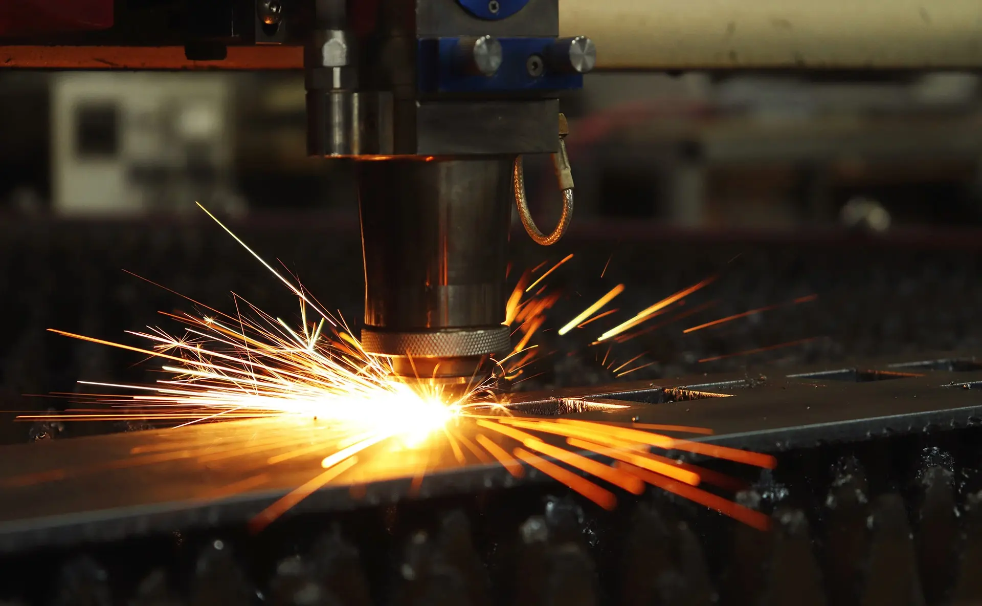 CNC laser cutting head cutting sheet metal