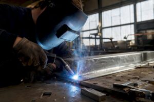Welder MIG welding galvanized steel joint