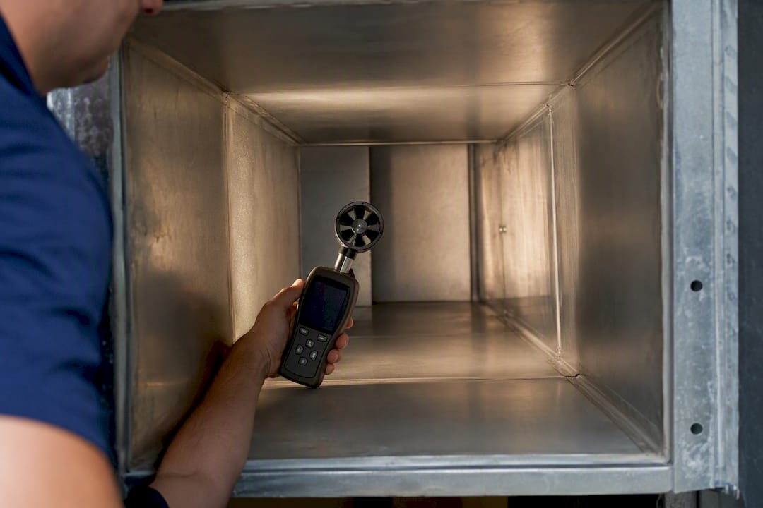Anemometer measuring airflow in HVAC plenum