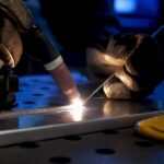 TIG torch welding a thin aluminum coupon
