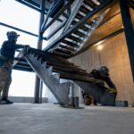 Crew installing steel commercial stair structure
