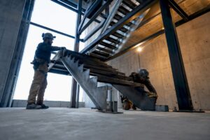 Crew installing steel commercial stair structure