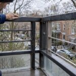 Montreal balcony railing showing different metal conditions
