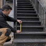 Contractor measuring a Montreal exterior stair riser